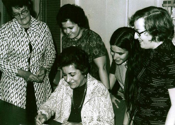 KenCCID founding members (1974) signing KenCCID’s Incorporation. Seated is Mrs. Ruth Frank; Standing from left to right are Teresa Vanderwoude, Barbara Bortell, Ellie Farsteinberg and Joan Hecht